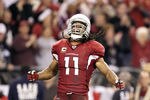 GLENDALE, AZ - DECEMBER 18:  Wide receiver Larry Fitzgerald #11 of the Arizona Cardinals celebrates after a 32 yard reception against the Cleveland Browns during overtime of the NFL game at the University of Phoenix Stadium on December 18, 2011 in Glendale, Arizona. The Cardinals defeated the Browns 20-17 in overtime. (Photo by Christian Petersen/Getty Images)