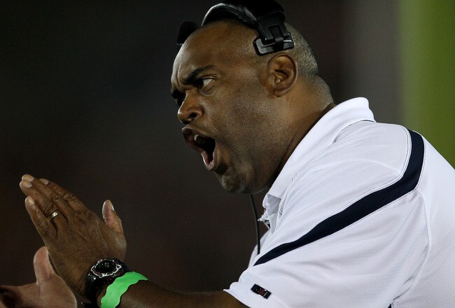 LOS ANGELES - SEPTEMBER 11:  Head coach Mike London of the Virginia Cavaliers exhorts his team against the USC Trojans at Los Angeles Memorial Coliseum on September 11, 2010 in Los Angeles, California. (Photo by Stephen Dunn/Getty Images)