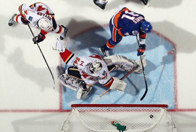 UNIONDALE, NY - DECEMBER 29:  John Tavares #91 of the New York Islanders scores the game winning goal at 3:20 of the third period against Miikka Kiprusoff #34 of the Calgary Flames at the Nassau Veterans Memorial Coliseum on December 29, 2011 in Uniondale, New York. The Islanders defeated the Flames 3-1. (Photo by Bruce Bennett/Getty Images)