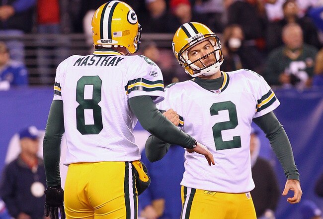 EAST RUTHERFORD, NJ - DECEMBER 04:  Mason Crosby #2 and Tim Masthay #8 of the Green Bay Packers celebrate after Crosby kicked a successful 30-yard game winning field goal in the fourth quarter against the New York Giants at MetLife Stadium on December 4, 2011 in East Rutherford, New Jersey.  (Photo by Al Bello/Getty Images)
