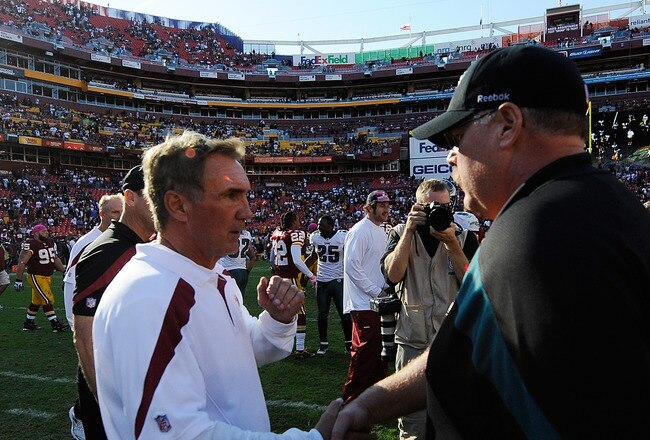 LANDOVER, MD - OCTOBER 16:  Washington Redskins head coach Mike Shanahan talks with Philadelphia Eagles head coach Andy Reid after a game at FedExField on October 16, 2011 in Landover, Maryland.  The Philadelphia Eagles defeated the Washington Redskins 20-13.  (Photo by Patrick McDermott/Getty Images)