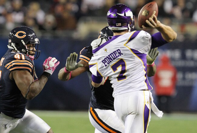 CHICAGO, IL - OCTOBER 16: Amobi Okoye #91 and Israel Idonije #71 of the Chicago Bears tackles Christian Ponder #7 of the Minnesota Vikings at Soldier Field on October 16, 2011 in Chicago, Illinois.  (Photo by Tasos Katopodis /Getty Images)
