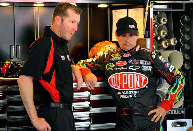 FORT WORTH, TX - APRIL 08:  Jeff Gordon (R), driver of the #24 DuPont Chevrolet, talks with crew chief Alan Gustafson (L) in the garage during practice for the NASCAR Sprint Cup Series Samsung Mobile 500 at Texas Motor Speedway on April 8, 2011 in Fort Worth, Texas.  (Photo by Jared C. Tilton/Getty Images for NASCAR)