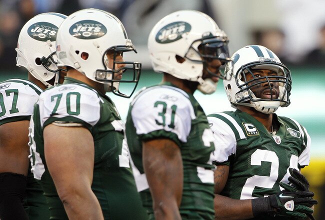 EAST RUTHERFORD, NJ - DECEMBER 24: Darrelle Revis #24 of the New York Jets looks up at the score board as he stands next to teammates Calvin Pace #97, Mike DeVito #70 and Antonio Cromartie #31during a game against the New York Giants at MetLife Stadium on December 24, 2011 in East Rutherford. New Jersey. The Giants won 29 - 14. (Photo by Rich Schultz/Getty Images)