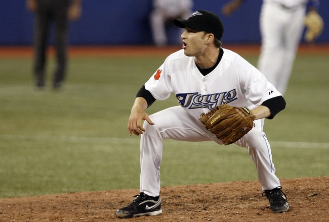 TORONTO, CANADA - JULY 15: Jason Frasor #54 of the Toronto Blue Jays reacts to a strike call against the New York Yankees during MLB action at The Rogers Centre July 15, 2011 in Toronto, Ontario, Canada. (Photo by Abelimages/Getty Images)