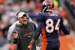 DENVER - NOVEMBER 28:  Head coach Josh McDaniels of the Denver Broncos celebrates a touchdown by Knowshon Moreno with wide receiver Brandon Lloyd #84 against the St. Louis Rams at INVESCO Field at Mile High on November 28, 2010 in Denver, Colorado. The Rams defeated the Broncos 36-33. (Photo by Justin Edmonds/Getty Images)