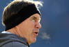 FOXBORO, MA - DECEMBER 24:  Bill Belichick of the New England Patriots watches his team completes drills before a game with the Miami Dolphins at Gillette Stadium on December 24, 2011 in Foxboro, Massachusetts. (Photo by Jim Rogash/Getty Images)