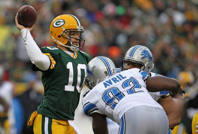 GREEN BAY, WI - JANUARY 01: Matt Flynn #10 of the Green Bay Packers throws a pass under pressure from Cliff Avril #92 and Ndamukong Suh #90 of the Detroit Lions at Lambeau Field on January 1, 2012 in Green Bay, Wisconsin. (Photo by Jonathan Daniel/Getty Images)