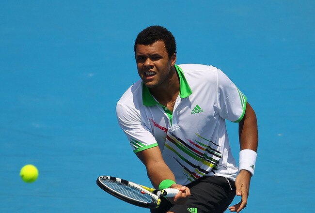MELBOURNE, AUSTRALIA - JANUARY 22:  Jo-Wilfried Tsonga of France plays a volley in his third round match against Alexandr Dolgopolov of Ukraine during day six of the 2011 Australian Open at Melbourne Park on January 22, 2011 in Melbourne, Australia.  (Photo by Julian Finney/Getty Images)