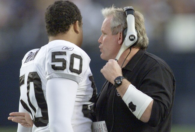 15 Dec 2001:   Chuck Bresnahan defensive coordinator for the Oakland Raiders talks with linebacker Eric Barton #50  during their game at Qualcomm Stadium in San Diego, California.  The Raiders won 13-6. DIGITAL IMAGE   Mandatory Credit:  Stephen Dunn/ALLSPORT