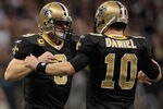 NEW ORLEANS, LA - JANUARY 01:  Drew Brees #9 celebrates after a touchdown with  Chase Daniel #10 of the New Orleans Saints during the game against the Carolina Panthers at the Mercedes-Benz Superdome on January 1, 2012 in New Orleans, Louisiana.  (Photo by Chris Graythen/Getty Images)