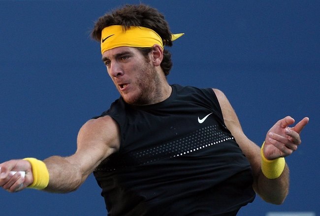 NEW YORK - SEPTEMBER 14:  Juan Martin Del Potro of Argentina returns a shot against Roger Federer of Switzerland during the Men's Singles final on day fifteen of the 2009 U.S. Open at the USTA Billie Jean King National Tennis Center on September 14, 2009 in the Flushing neighborhood of the Queens borough of New York City.  (Photo by Jim McIsaac/Getty Images)