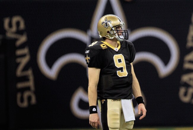 NEW ORLEANS, LA - JANUARY 01:  Drew Brees #9 of the New Orleans Saints stands on the field during the game against the Carolina Panthers at the Mercedes-Benz Superdome on January 1, 2012 in New Orleans, Louisiana.  (Photo by Chris Graythen/Getty Images)