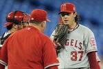 TORONTO, CANADA - SEPTEMBER 19:  Manager Mike Scioscia #14 of the Los Angeles Angels of Anaheim has words with his relief pitcher Scott Downs #37 in a MLB game against the Toronto Blue Jays on September 19, 2011 at the Rogers Centre in Toronto, Canada. The jays defeated the Angels 3-2 in 10 innings. (Photo by Claus Andersen/Getty Images)