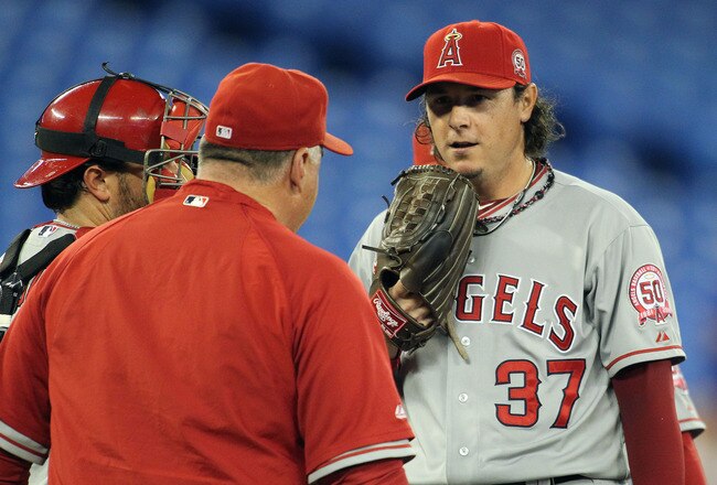 TORONTO, CANADA - SEPTEMBER 19:  Manager Mike Scioscia #14 of the Los Angeles Angels of Anaheim has words with his relief pitcher Scott Downs #37 in a MLB game against the Toronto Blue Jays on September 19, 2011 at the Rogers Centre in Toronto, Canada. The jays defeated the Angels 3-2 in 10 innings. (Photo by Claus Andersen/Getty Images)