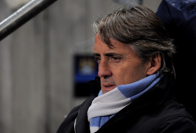 MANCHESTER, ENGLAND - DECEMBER 07:  Manchester City Manager Roberto Mancini looks on prior to the UEFA Champions League Group A match between Manchester City and FC Bayern Muenchen at the Etihad Stadium on December 7, 2011 in Manchester, England.  (Photo by Michael Regan/Getty Images)