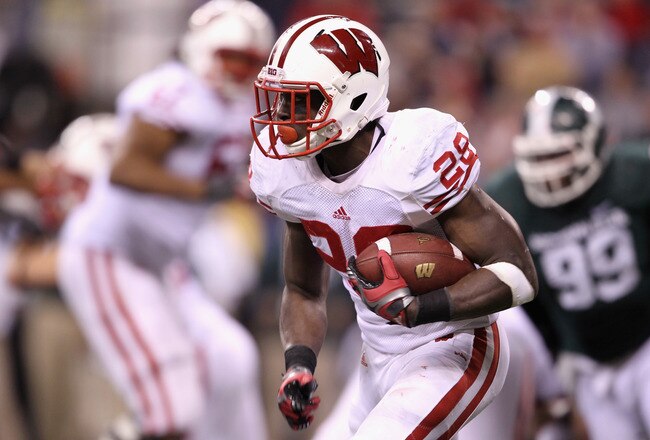 INDIANAPOLIS, IN - DECEMBER 03:  Montee Ball #28 of the Wisconsin Badgers runs the ball in the fourth quarter against the Michigan State Spartans during the Big 10 Conference Championship Game at Lucas Oil Stadium on December 3, 2011 in Indianapolis, Indiana.  (Photo by Andy Lyons/Getty Images)