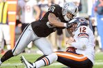 OAKLAND, CA - NOVEMBER 27:  Tyvon Branch #33 of the Oakland Raiders sacks quarterback Caleb Hanie #12 of the Chicago Bears at O.co Coliseum on November 27, 2011 in Oakland, California.  (Photo by Thearon W. Henderson/Getty Images)
