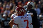 DALLAS, TX - JANUARY 02:  Case Keenum #7 of the Houston Cougars throws against the Penn State Nittany Lions during the TicketCity Bowl at Cotton Bowl Stadium on January 2, 2012 in Dallas, Texas.  (Photo by Ronald Martinez/Getty Images)