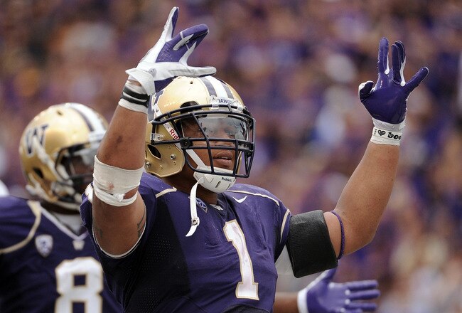 SEATTLE, WA - SEPTEMBER 24:  Chris Polk #1 of the Washington Huskies celebrates a 31-23 lead over the California Golden Bears in the last minute of the game at Husky Stadium on September 24, 2011 in Seattle, Washington.  (Photo by Harry How/Getty Images)