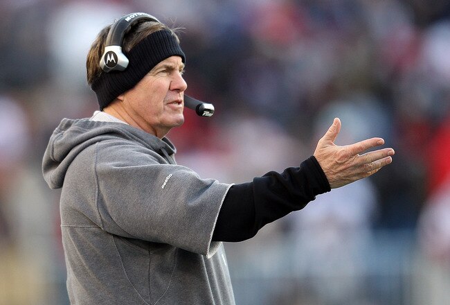 FOXBORO, MA - DECEMBER 24:  Bill Belichick of the New England Patriots reacts to an official's call during in the second half of a game against the Miami Dolphins at Gillette Stadium on December 24, 2011 in Foxboro, Massachusetts. (Photo by Jim Rogash/Getty Images)