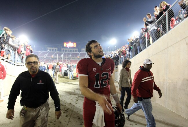 STANFORD, CA - NOVEMBER 26:  Andrew Luck #12 of the Stanford Cardinal smiles to the crowd as he leaves the field after beating the Notre Dame Fighting Irish at Stanford Stadium on November 26, 2011 in Stanford, California.  (Photo by Ezra Shaw/Getty Images)