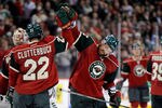 ST PAUL, MN - DECEMBER 29: Cal Clutterbuck #22 and Greg Zanon #5 of the Minnesota Wild celebrate a win against the Edmonton Oilers on December 29, 2011 at Xcel Energy Center in St Paul, Minnesota. The Wild defeated the Oilers 4-3. (Photo by Hannah Foslien/Getty Images)