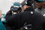 PHILADELPHIA, PA - JANUARY 01:  Michael Vick #7 of the Philadelphia Eagles hugs head coach Andy Reid after Vick threw a touchdown pass against the Washington Redskins during the second half at Lincoln Financial Field on January 1, 2012 in Philadelphia, Pennsylvania.  (Photo by Rob Carr/Getty Images)