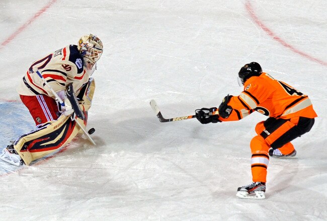 PHILADELPHIA, PA - JANUARY 02:  Henrik Lundqvist #30 of the New York Rangers makes a save on a penalty shot by Danny Briere #48 of the Philadelphia Flyers late in the third period during the 2012 Bridgestone NHL Winter Classic at Citizens Bank Park on January 2, 2012 in Philadelphia, Pennsylvania.  (Photo by Patrick McDermott/Getty Images)