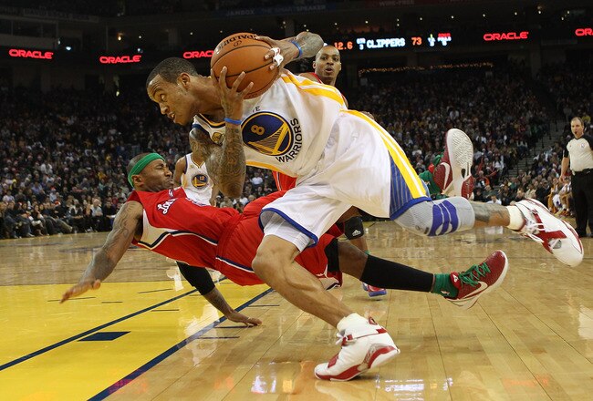 OAKLAND, CA - DECEMBER 25:  Monta Ellis #8 of the Golden State Warriors drives against Mo Williams #25 of the Los Angeles Clippers during the season opener at Oracle Arena on December 25, 2011 in Oakland, California.  NOTE TO USER: User expressly acknowledges and agrees that, by downloading and or using this photograph, User is consenting to the terms and conditions of the Getty Images License Agreement.  (Photo by Jed Jacobsohn/Getty Images)