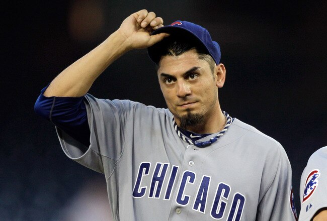 WASHINGTON, DC - JULY 07: Starting pitcher Matt Garza #17 of the Chicago Cubs is removed from the game by manager Mike Quade #8 during the third inning against the Washington Nationals at Nationals Park on July 7, 2011 in Washington, DC.  (Photo by Rob Carr/Getty Images)