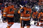 PHILADELPHIA, PA - JANUARY 02:  Andrej Meszaros #41 and Sean Couturier #14 of the Philadelphia Flyers walk onto the ice to start the third period during the 2012 Bridgestone NHL Winter Classic at Citizens Bank Park on January 2, 2012 in Philadelphia, Pennsylvania.  (Photo by Bruce Bennett/Getty Images)