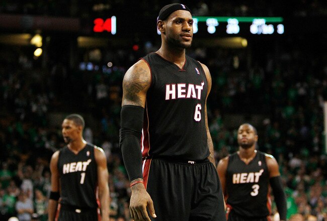 BOSTON, MA - OCTOBER 26: LeBron James #6, Chris Bosh #1 and Dwyane Wade #3 of the Miami Heat walk into position moments before losing to the Boston Celtics, 88-80, at the TD Banknorth Garden on October 26, 2010 in Boston, Massachusetts. NOTE TO USER: User expressly acknowledges and agrees that, by downloading and or using this photograph, User is consenting to the terms and conditions of the Getty Images License Agreement.  (Photo by Jim Rogash/Getty Images)