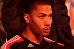 MIAMI, FL - MAY 22:  Derrick Rose #1 of the Chicago Bulls looks on from the bench during pregame festivities against the Miami Heat in Game Three of the Eastern Conference Finals during the 2011 NBA Playoffs on May 22, 2011 at American Airlines Arena in Miami, Florida.  NOTE TO USER: User expressly acknowledges and agrees that, by downloading and or using this photograph, User is consenting to the terms and conditions of the Getty Images License Agreement.  (Photo by Mike Ehrmann/Getty Images)