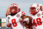ORLANDO, FL - JANUARY 02:  Ameer Abdullah #8 of the Nebraska Cornhuskers celebrates a touchdown with teammate Tobi Okuyemi #48 during the Capitol One Bowl against the South Carolina Gamecocks at Florida Citrus Bowl on January 2, 2012 in Orlando, Florida.  (Photo by Mike Ehrmann/Getty Images)