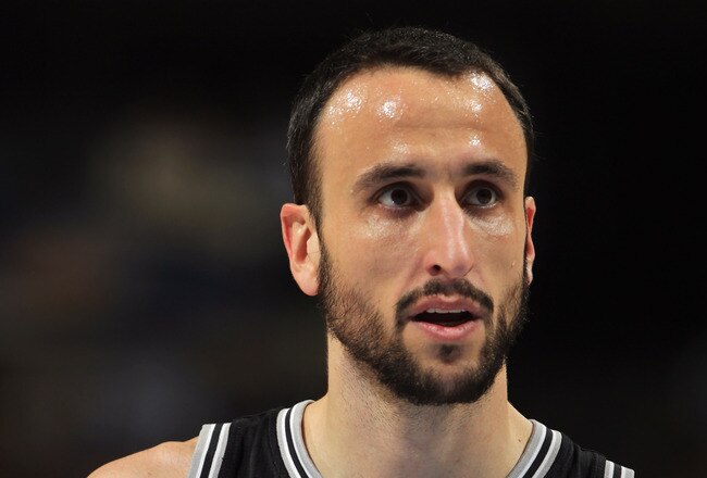 DENVER, CO - MARCH 23:  Manu Ginobili #20 of the San Antonio Spurs looks on during a break in the against the Denver Nuggets at the Pepsi Center on March 23, 2011 in Denver, Colorado. The Nuggets defeated the Spurs 115-112. NOTE TO USER: User expressly acknowledges and agrees that, by downloading and or using this photograph, User is consenting to the terms and conditions of the Getty Images License Agreement.  (Photo by Doug Pensinger/Getty Images)