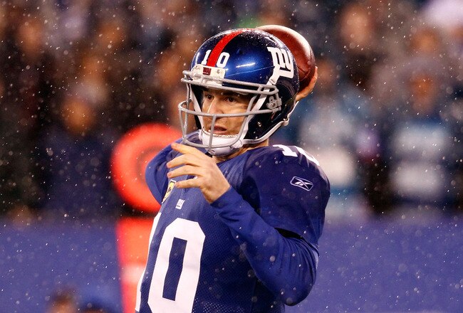 EAST RUTHERFORD, NJ - JANUARY 01:   Eli Manning #10 of the New York Giants looks to pass against the Dallas Cowboys at MetLife Stadium on January 1, 2012 in East Rutherford, New Jersey.  (Photo by Jeff Zelevansky/Getty Images)
