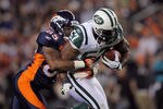 DENVER, CO - NOVEMBER 17:  Bart Scott #57 of the New York Jets returns a fumble for yards in the first half against Virgil Green #85 of the Denver Broncos at Invesco Field at Mile High on November 17, 2011 in Denver, Colorado.  (Photo by Doug Pensinger/Getty Images)