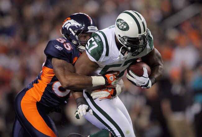 DENVER, CO - NOVEMBER 17:  Bart Scott #57 of the New York Jets returns a fumble for yards in the first half against Virgil Green #85 of the Denver Broncos at Invesco Field at Mile High on November 17, 2011 in Denver, Colorado.  (Photo by Doug Pensinger/Getty Images)