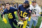 ANN ARBOR, MI - NOVEMBER 26:  Denard Robinson #16 of the Michigan Wolverines celebrates with students after beating Ohio State 40-34 at Michigan Stadium on November 26, 2011 in Ann Arbor, Michigan. (Photo by Gregory Shamus/Getty Images)