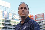 ARLINGTON, TX - OCTOBER 16:  General Manager of the New York Yankees Brian Cashman looks on during a game against the Texas Rangers in Game Two of the ALCS during the 2010 MLB Playoffs at Rangers Ballpark in Arlington on October 16, 2010 in Arlington, Texas.  (Photo by Stephen Dunn/Getty Images)