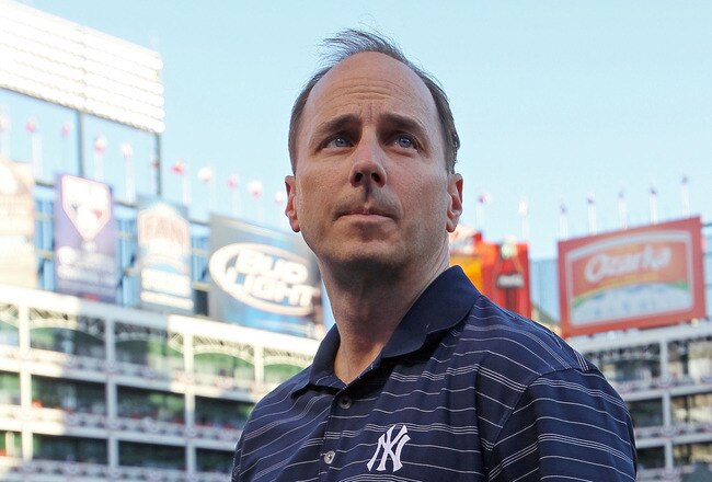 ARLINGTON, TX - OCTOBER 16:  General Manager of the New York Yankees Brian Cashman looks on during a game against the Texas Rangers in Game Two of the ALCS during the 2010 MLB Playoffs at Rangers Ballpark in Arlington on October 16, 2010 in Arlington, Texas.  (Photo by Stephen Dunn/Getty Images)