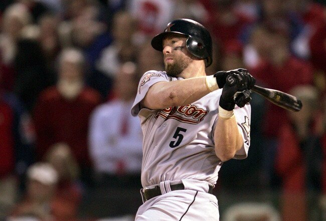 ST. LOUIS - OCTOBER 20:  Jeff Bagwell #5 of the Houston Astros hits a single to bring in the game-tying run in the ninth inning of Game 6 of the National League Championship Series against the St. Louis Cardinals during the 2004 Major League Baseball Playoffs on October 20, 2004 at Busch Stadium in St. Louis, Missouri.   The Cardinals went on to defeat the Astros 6-4 in the 12th inning to tie the series 3-3.  (Photo By Stephen Dunn/Getty Images)