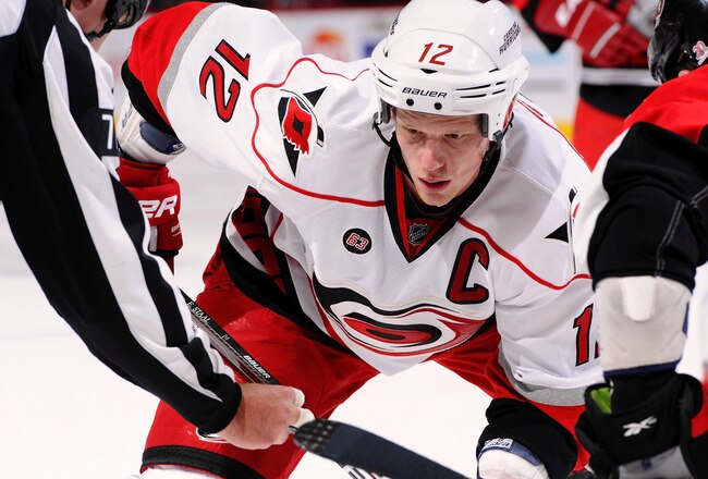 OTTAWA, ON - NOVEMBER 27:  Eric Staal #12 of the Carolina Hurricanes watches intently at a faceoff  in a game against the Ottawa Senators at Scotiabank Place on November 27, 2011 in Ottawa, Canada.  (Photo by Phillip MacCallum/Getty Images)