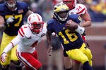ANN ARBOR, MI - NOVEMBER 19:  Denard Robinson #16 of the Michigan Wolverines tries to out run the tackle of Lavonte David #4 of the Nebraska Cornhuskers at Michigan Stadium on November 19, 2011 in Ann Arbor, Michigan. Michigan won the game 45-17. (Photo by Gregory Shamus/Getty Images)