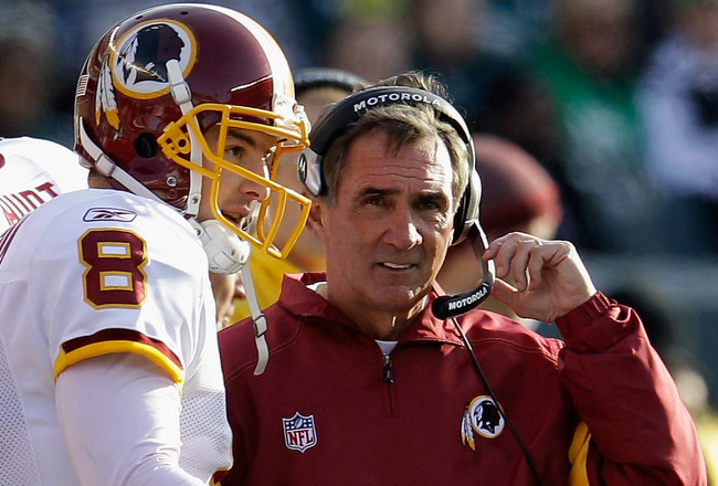PHILADELPHIA, PA - JANUARY 01:  Rex Grossman #8 of the Washington Redskins talks with head coach Mike Shanahan during the second half against the Philadelphia Eagles at Lincoln Financial Field on January 1, 2012 in Philadelphia, Pennsylvania.  (Photo by Rob Carr/Getty Images)