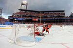 PHILADELPHIA, PA - JANUARY 02:  Claude Giroux #28 of the Philadelphia Flyers fights for the puck against Henrik Lundqvist #30 of the New York Rangers during the 2012 Bridgestone NHL Winter Classic at Citizens Bank Park on January 2, 2012 in Philadelphia, Pennsylvania.  (Photo by Rob Carr/Getty Images)