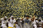 NEW ORLEANS, LA - JANUARY 03:  The Michigan Wolverines celebrate as confetti falls after they won 23-20 against the Virginia Tech Hokies during the Allstate Sugar Bowl at Mercedes-Benz Superdome on January 3, 2012 in New Orleans, Louisiana.  (Photo by Chris Graythen/Getty Images)