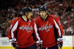 WASHINGTON, DC - DECEMBER 30:  Nicklas Backstrom #19 of the Washington Capitals and Troy Brouwer #20 of the Washington Capitals talk between plays during a game against the Buffalo Sabres at Verizon Center on December 30, 2011 in Washington, DC.  (Photo by Patrick McDermott/Getty Images)