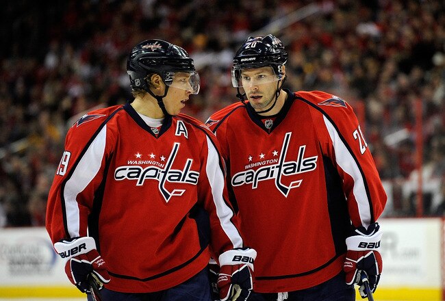 WASHINGTON, DC - DECEMBER 30:  Nicklas Backstrom #19 of the Washington Capitals and Troy Brouwer #20 of the Washington Capitals talk between plays during a game against the Buffalo Sabres at Verizon Center on December 30, 2011 in Washington, DC.  (Photo by Patrick McDermott/Getty Images)